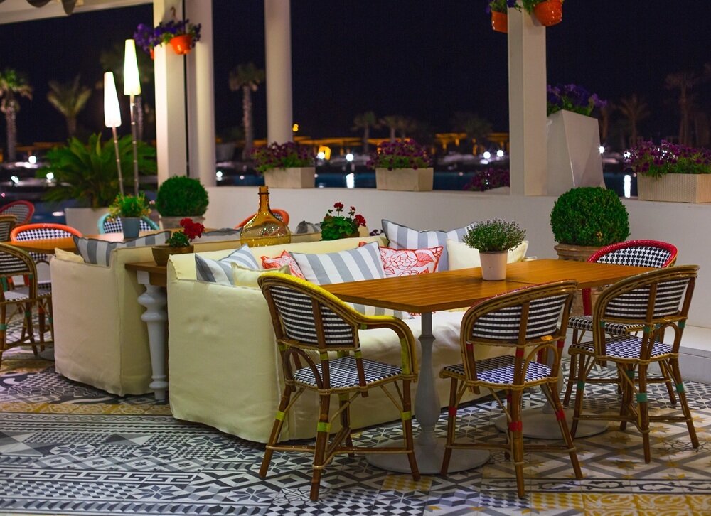 sitting-table-with-chairs-yellow-sofa-restaurant-with-panoramic-view.jpg